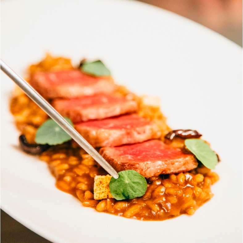Arroz meloso de presa ibérica