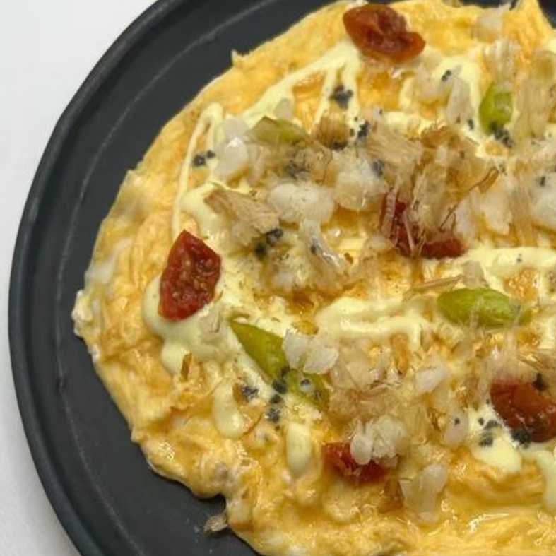 Tortilla vaga de bacalao al pilpil, piparras y katsobushi